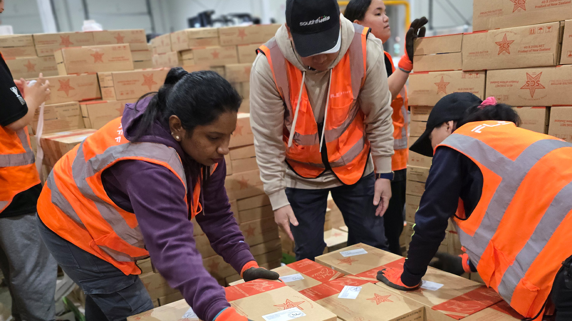 Warehouse team sorting packaged goods